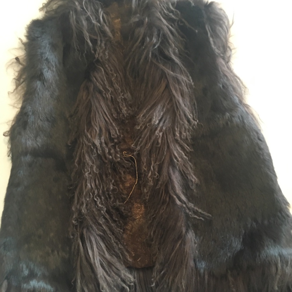 Fur and Tibetan Lamb trimmed, reversible vest.